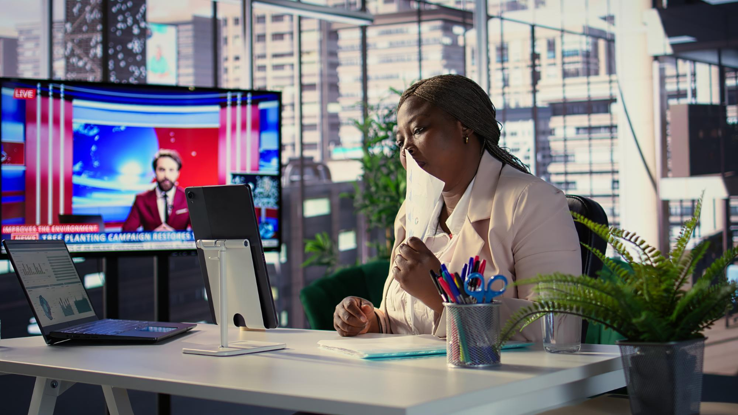 Corporate Lady Watching TV - Media Relations Kenya Africa